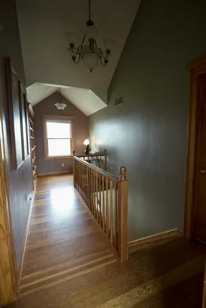 a view of a hallway with windows