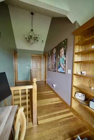 a view of a bedroom with furniture and window