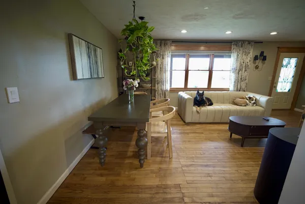 a living room with furniture and a large window