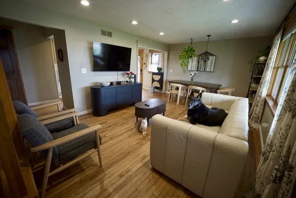 a living room with furniture and a flat screen tv