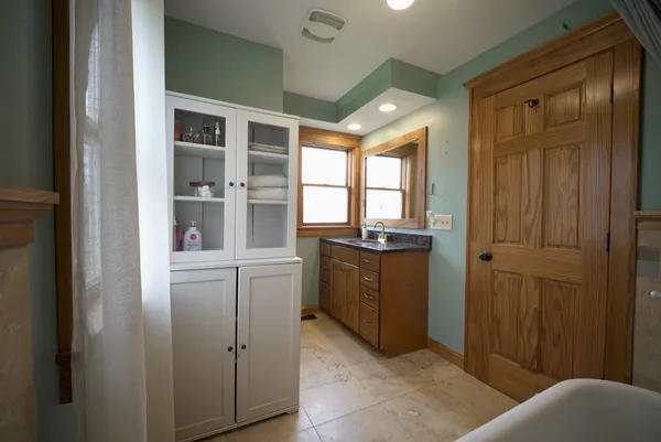 a room with window and cabinet