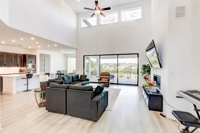 a living room with furniture large window with outer view