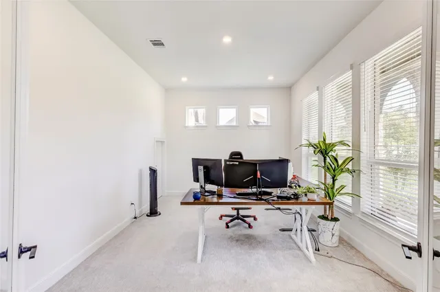 a view of a livingroom with furniture and a window