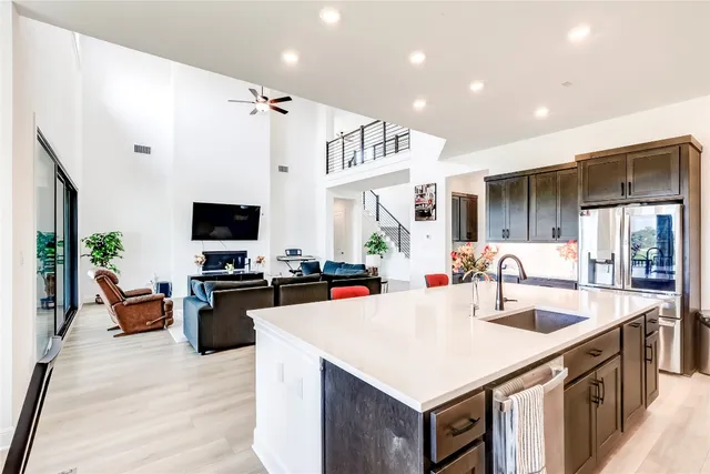 a bathroom with a sink a toilet and a window