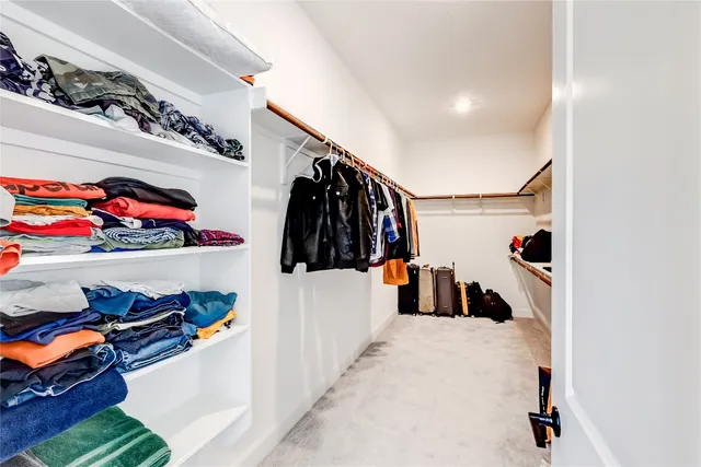 a spacious bathroom with a double vanity sink mirror and bathtub