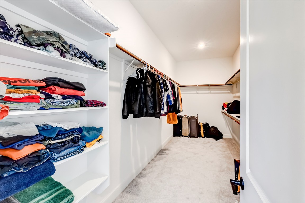 462 Old Stone Road Austin, TX 78737 - Photo 28 of 39 a view of walk in closet with clothes and shoes