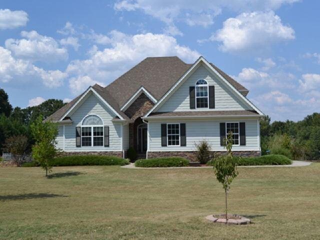 2070 Enterprise Road Buckhead, GA 30625 - Photo 1 of 1 a front view of a house with a yard