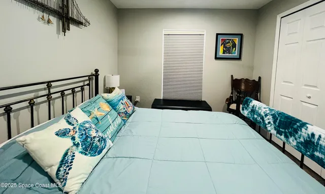 a hallway with a flower pot and a dining table