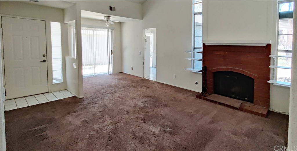 31586 Paseo De Las Olas Temecula, CA 92592 - Photo 3 of 14 an empty room with fireplace