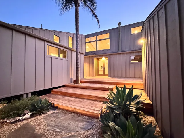 a view of house with patio outdoor seating and city view