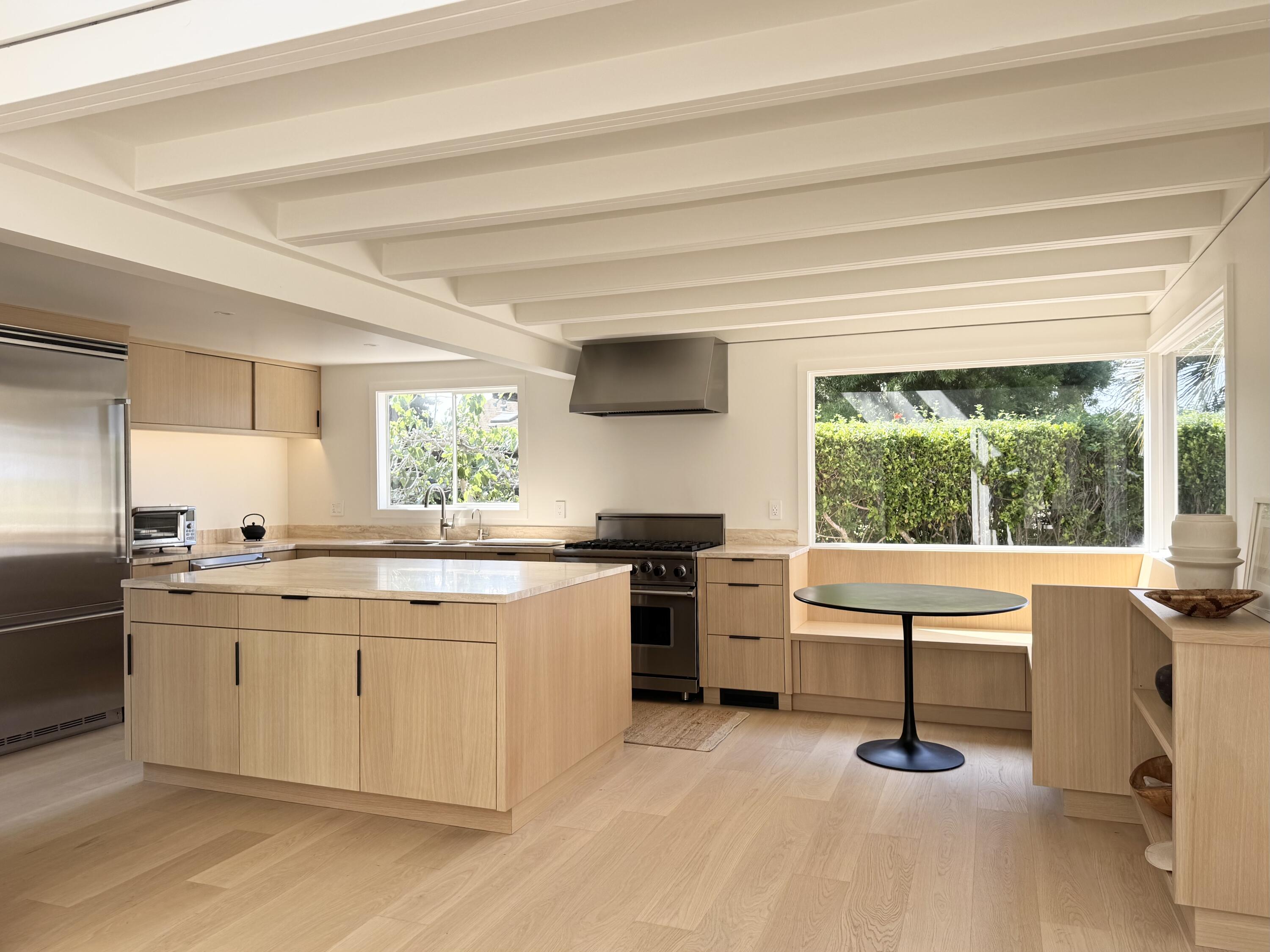 8132 Puesta Del Sol Carpinteria, CA 93013 - Photo 6 of 13 a kitchen with a stove a sink and a refrigerator