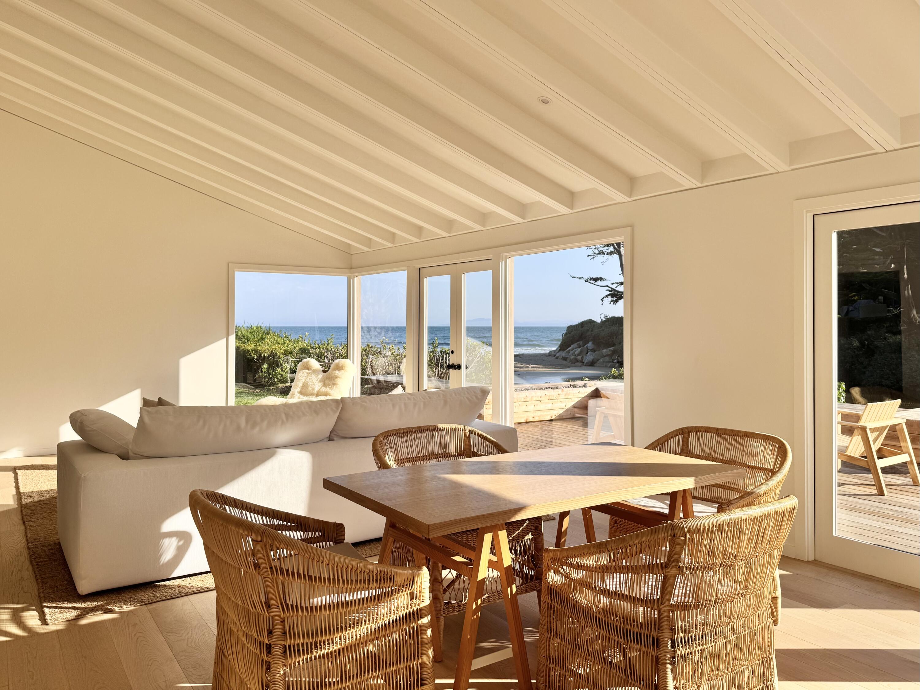 8132 Puesta Del Sol Carpinteria, CA 93013 - Photo 9 of 13 a living room with furniture a large window and a table