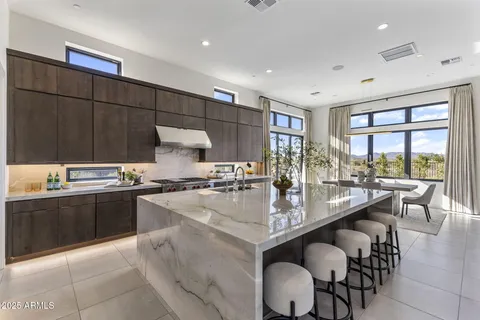 a bedroom with a large bed and a large window