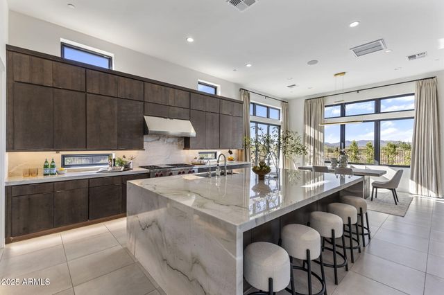 a bedroom with a large bed and a large window