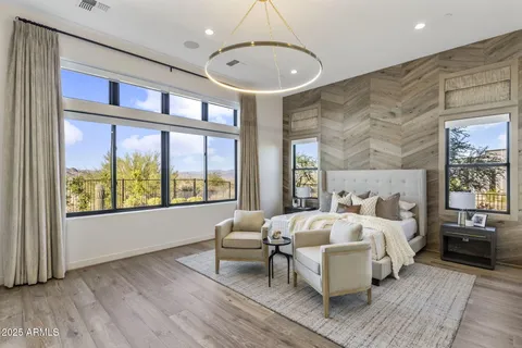 a bathroom with a sink a toilet a mirror and shower