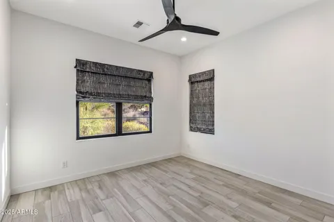 a view of a house with swimming pool and sitting area