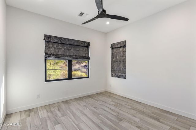 a view of a house with swimming pool and sitting area
