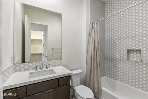 a kitchen with a sink stove and refrigerator