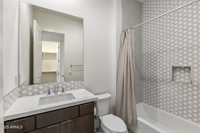 a kitchen with a sink stove and refrigerator