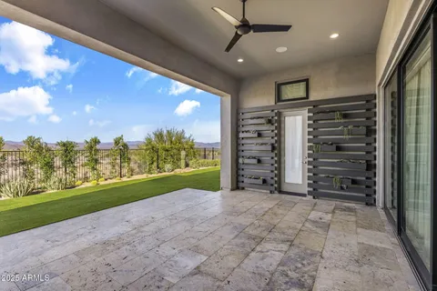 a outdoor space with lots of tables a large window and chairs