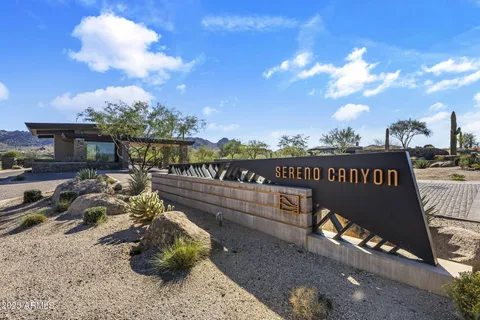 a kitchen with stainless steel appliances granite countertop a sink a stove a table and chairs