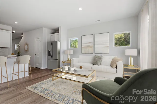 a living room with furniture and a rug