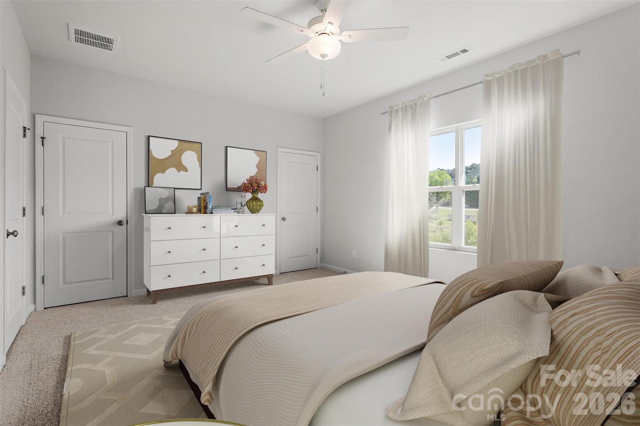 3013 Kingsfield Road, Unit 48 Charlotte, NC 28208 - Photo 8 of 10 a bedroom with a bed and a chandelier