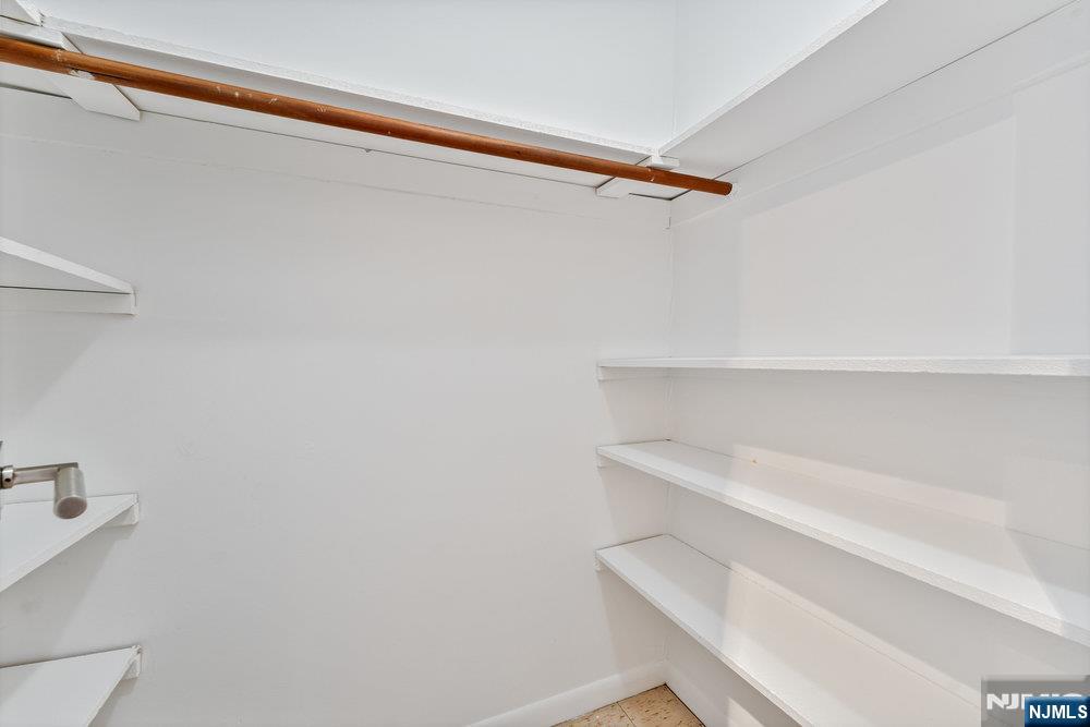 160 Overlook Avenue, Unit 20D Hackensack, NJ 07601 - Photo 13 of 22 a view of walk in closet with empty racks