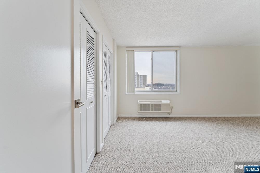 160 Overlook Avenue, Unit 20D Hackensack, NJ 07601 - Photo 14 of 22 a view of an empty room with a window