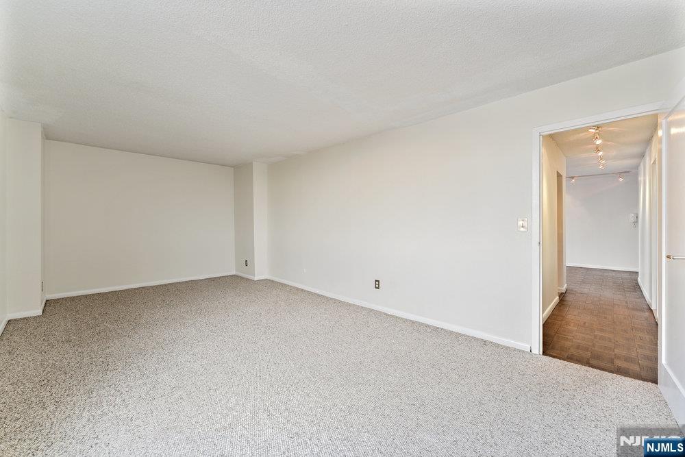 160 Overlook Avenue, Unit 20D Hackensack, NJ 07601 - Photo 18 of 22 a view of an empty room and wooden floor