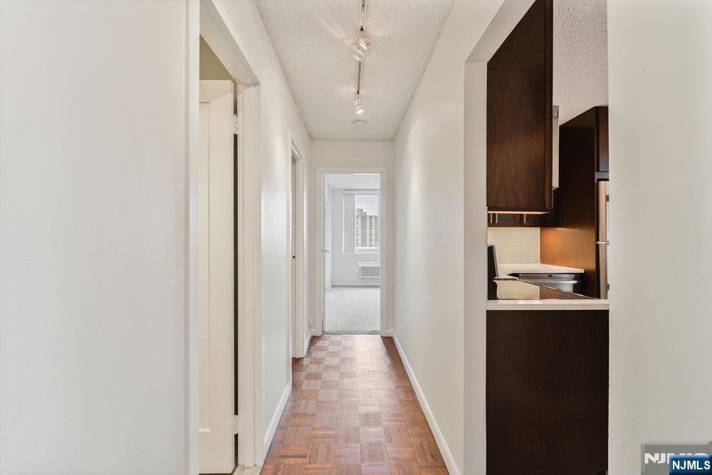 160 Overlook Avenue, Unit 20D Hackensack, NJ 07601 - Photo 10 of 22 a view of a hallway with a dining room