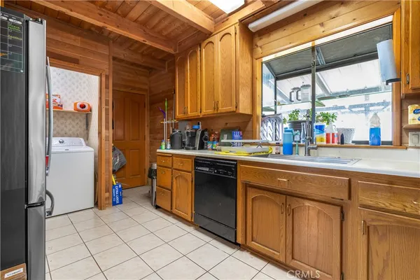 a kitchen with a sink and a refrigerator