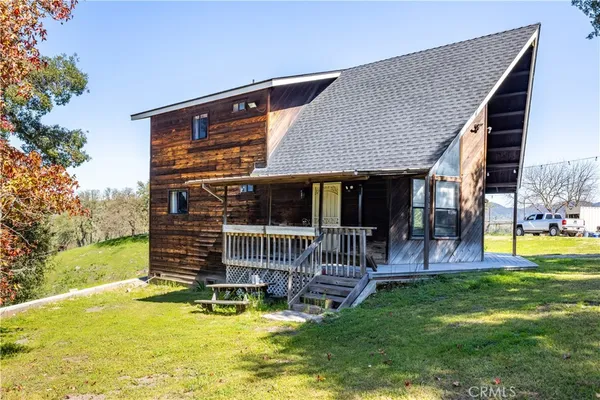 a view of house with a swimming pool