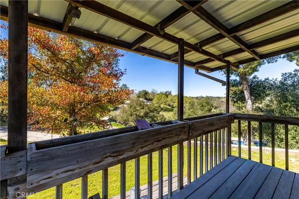 a view of balcony with wooden floor