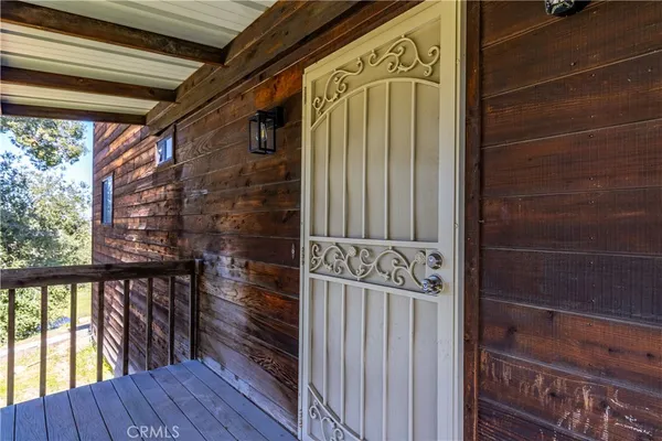 a view of a wooden door and a window