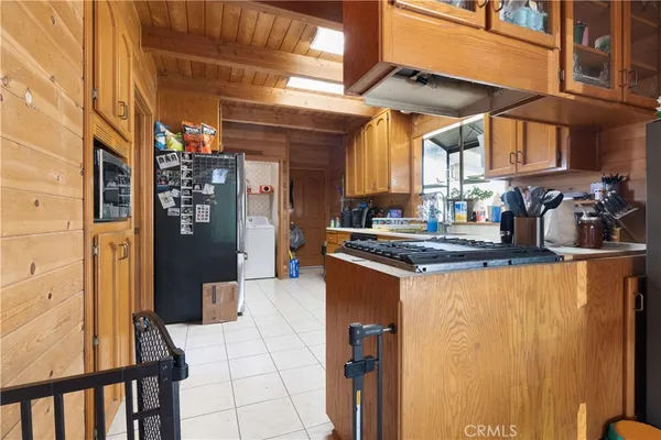 a kitchen view with a counter top space and stainless steel appliances