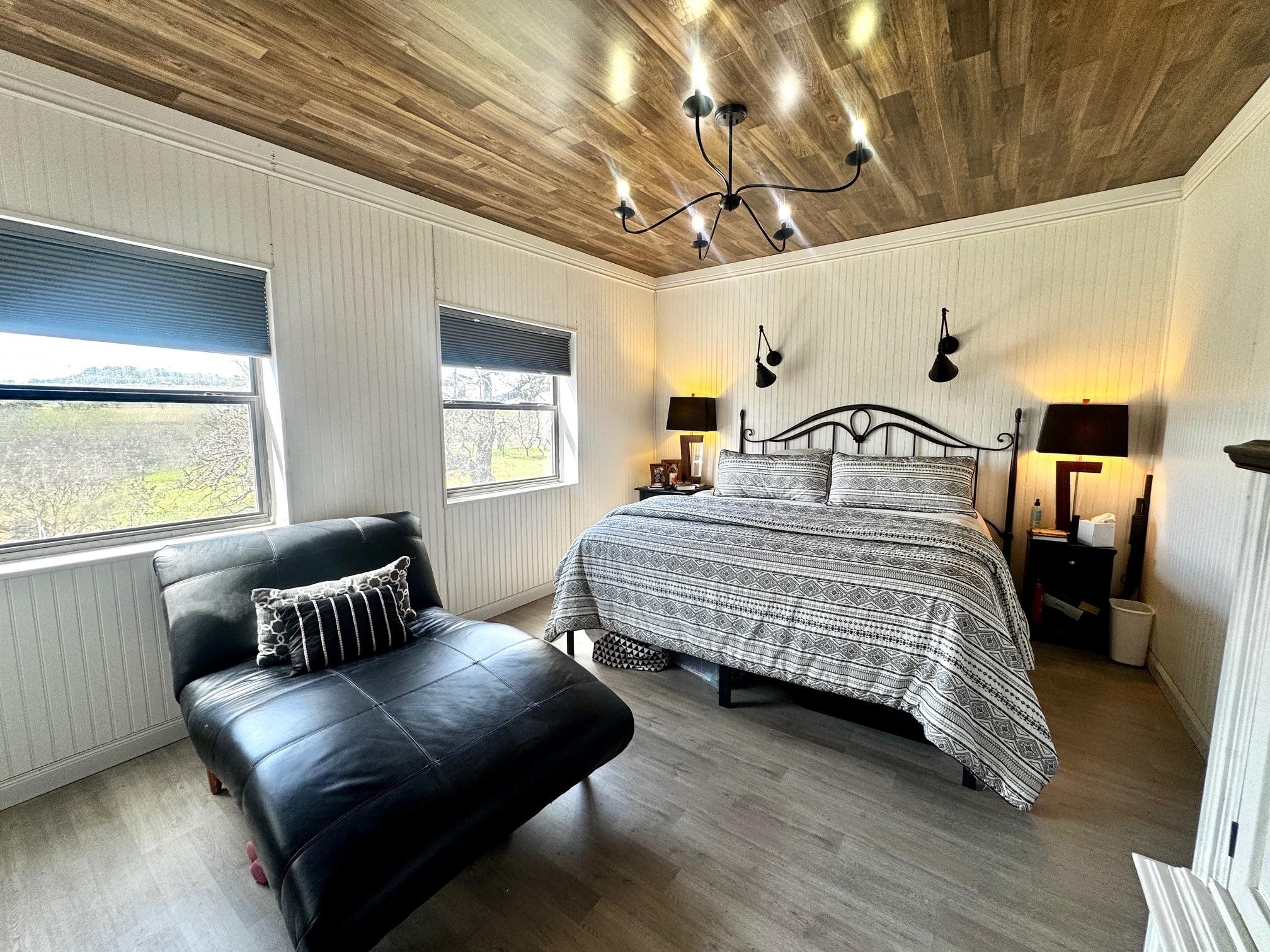 6410 Gray Road Valley Spring, TX 76885 - Photo 15 of 31 a bedroom with a bed couch and window