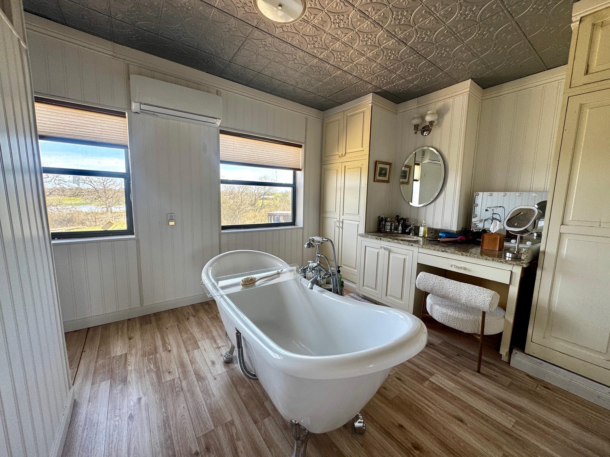 6410 Gray Road Valley Spring, TX 76885 - Photo 16 of 31 a bathroom with a sink a window and tub