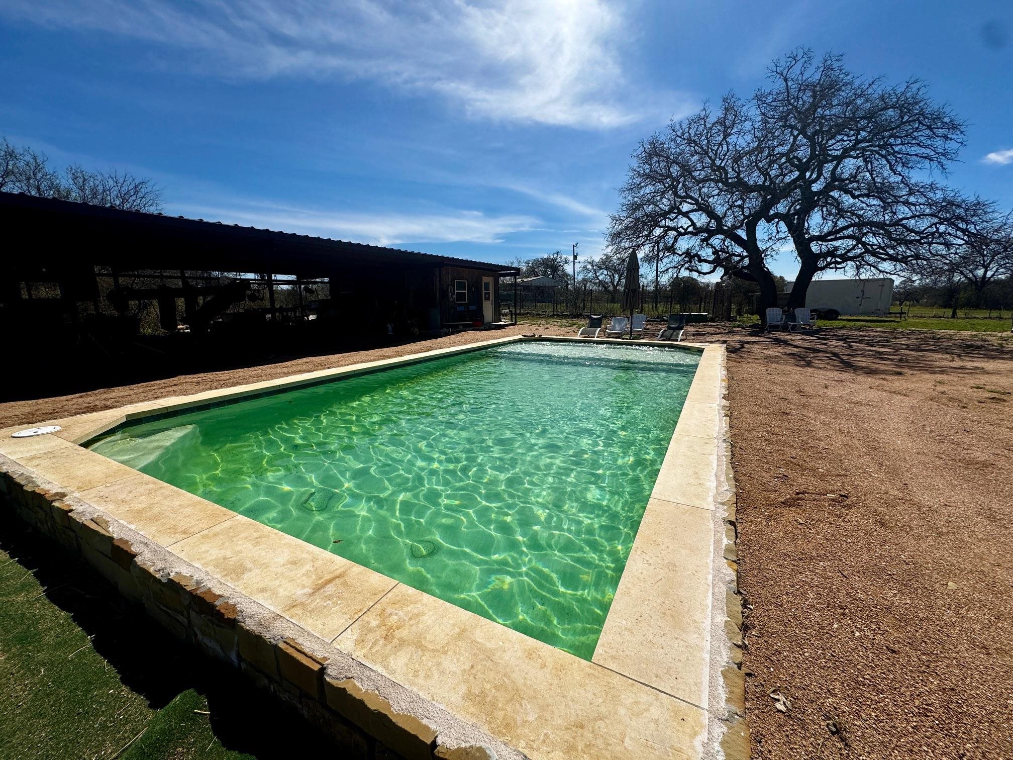 6410 Gray Road Valley Spring, TX 76885 - Photo 21 of 31 a view of a swimming pool with a yard