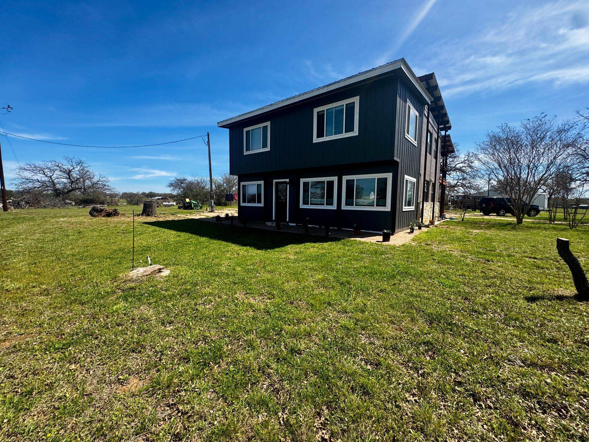 6410 Gray Road Valley Spring, TX 76885 - Photo 26 of 31 a front view of a house with a yard