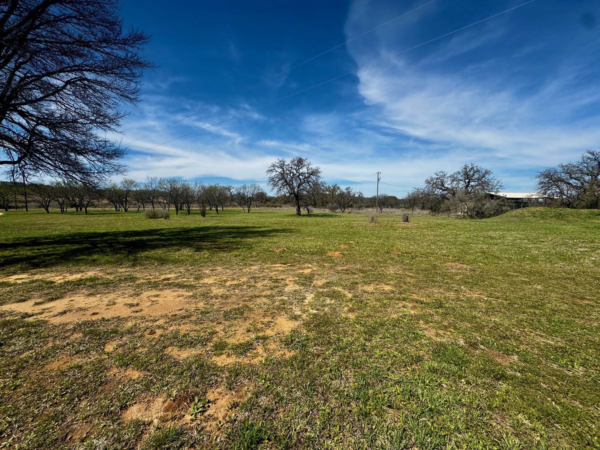 6410 Gray Road Valley Spring, TX 76885 - Photo 28 of 31 a view of a large body of water with a building in the background