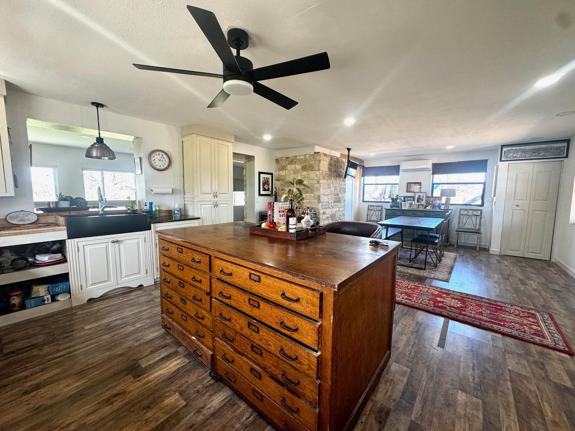 6410 Gray Road Valley Spring, TX 76885 - Photo 5 of 31 a kitchen with stainless steel appliances granite countertop a sink stove and wooden floor