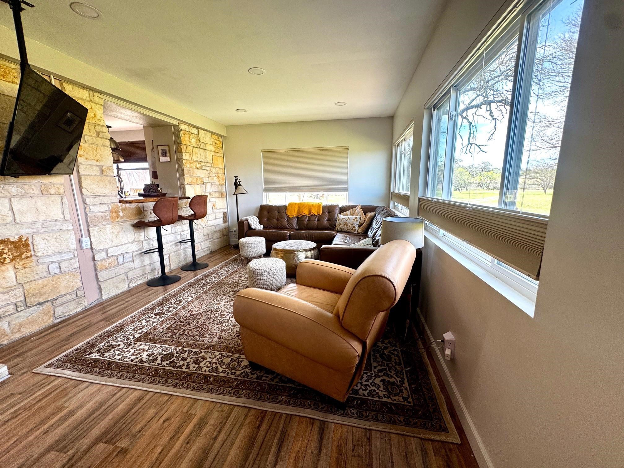 6410 Gray Road Valley Spring, TX 76885 - Photo 10 of 31 a living room with furniture and a flat screen tv