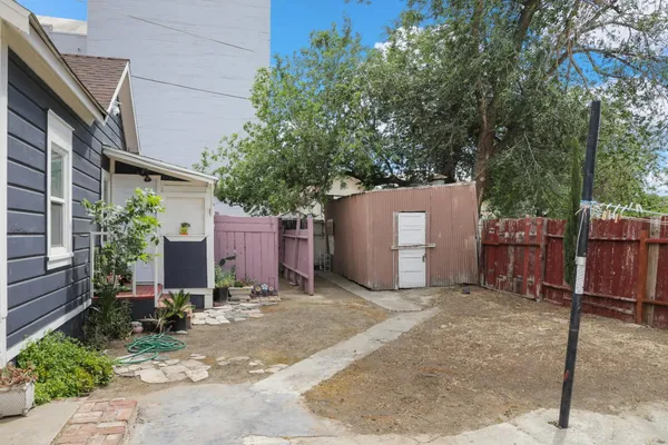 a view of a garage with a tree