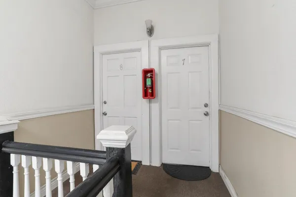 a view of a car park in front of house