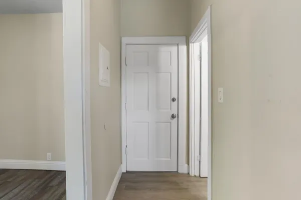 a kitchen with a sink cabinets appliances and a window