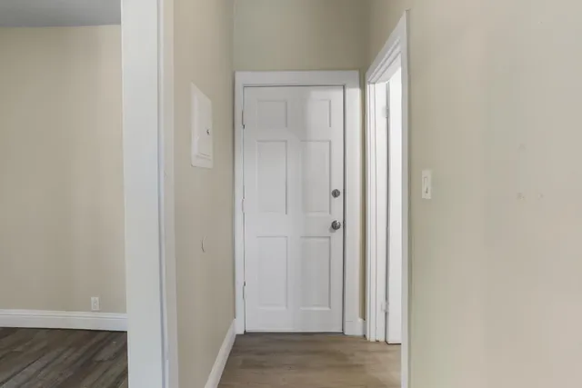 a kitchen with a sink cabinets appliances and a window