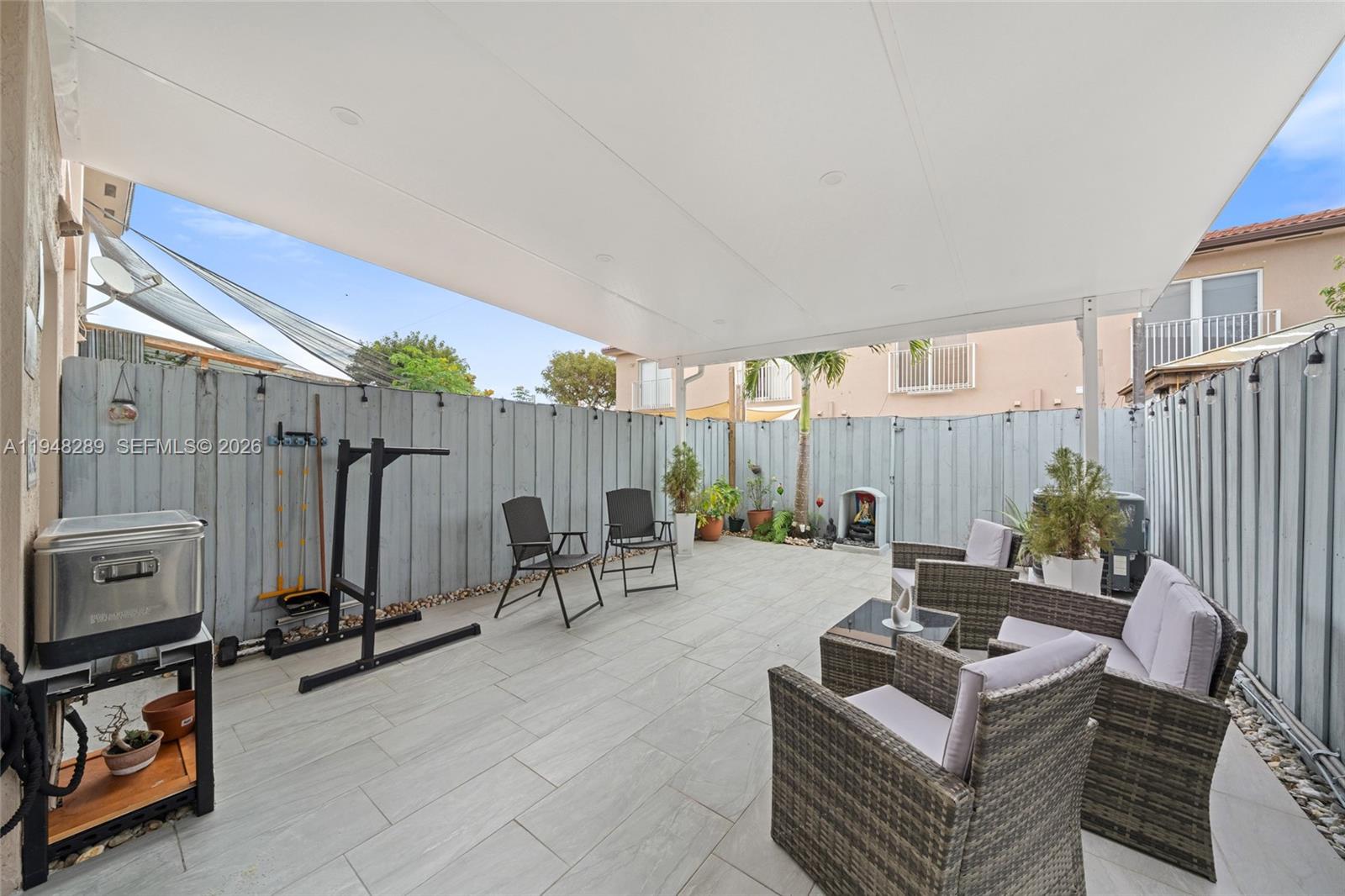 13770 Southwest 170th Lane Miami, FL 33177 - Photo 11 of 24 a living room with furniture a rug and a table