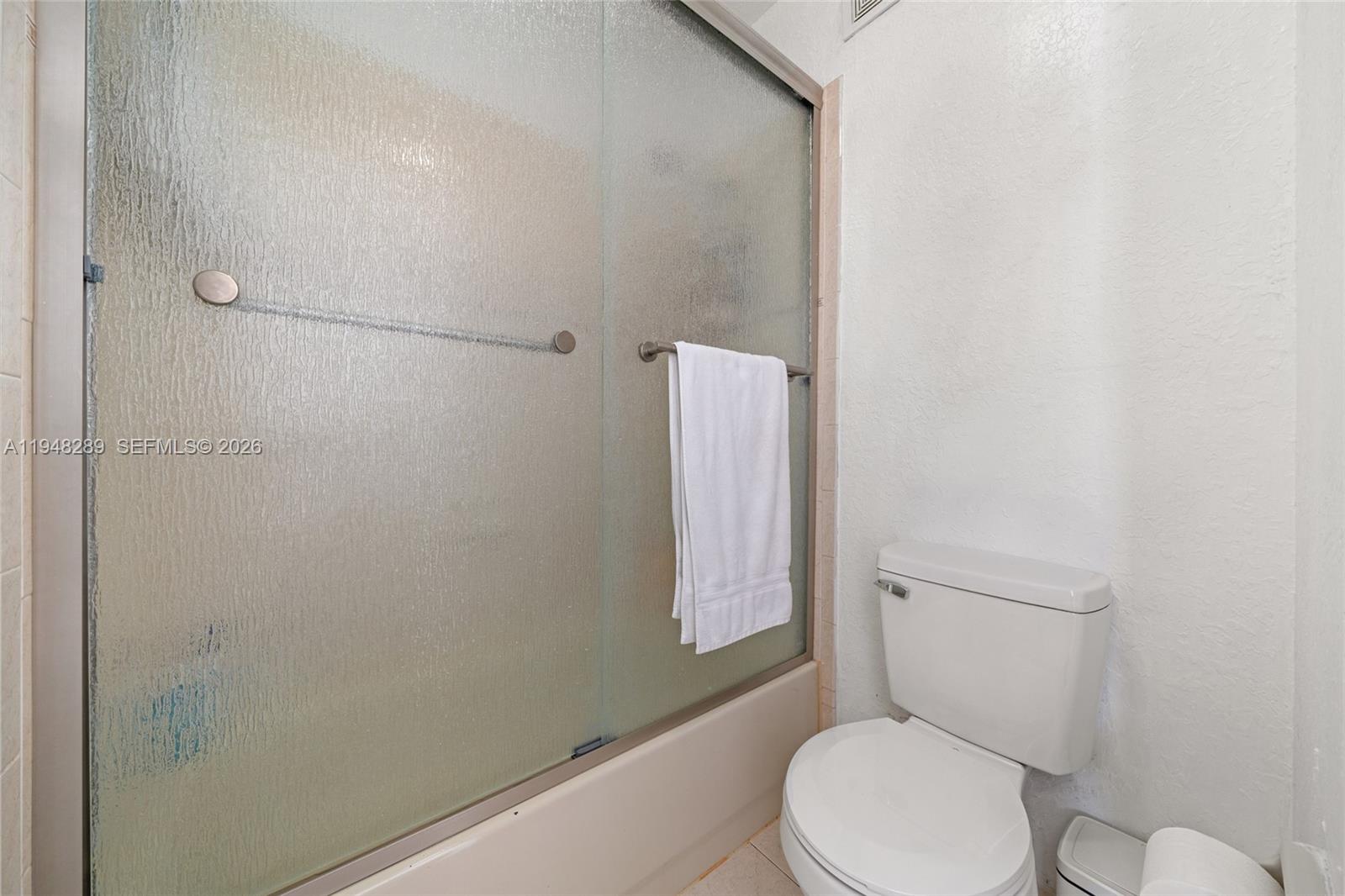 13770 Southwest 170th Lane Miami, FL 33177 - Photo 19 of 24 a white toilet sitting next to a shower