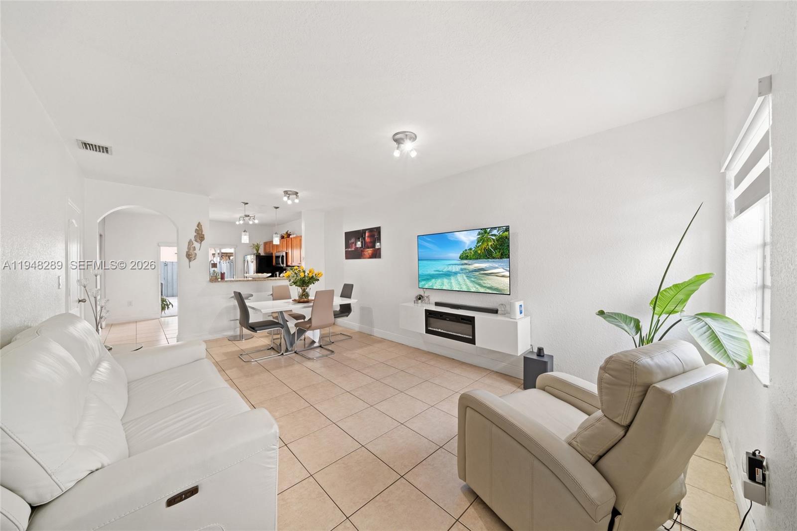 13770 Southwest 170th Lane Miami, FL 33177 - Photo 2 of 24 a living room with furniture and a couch